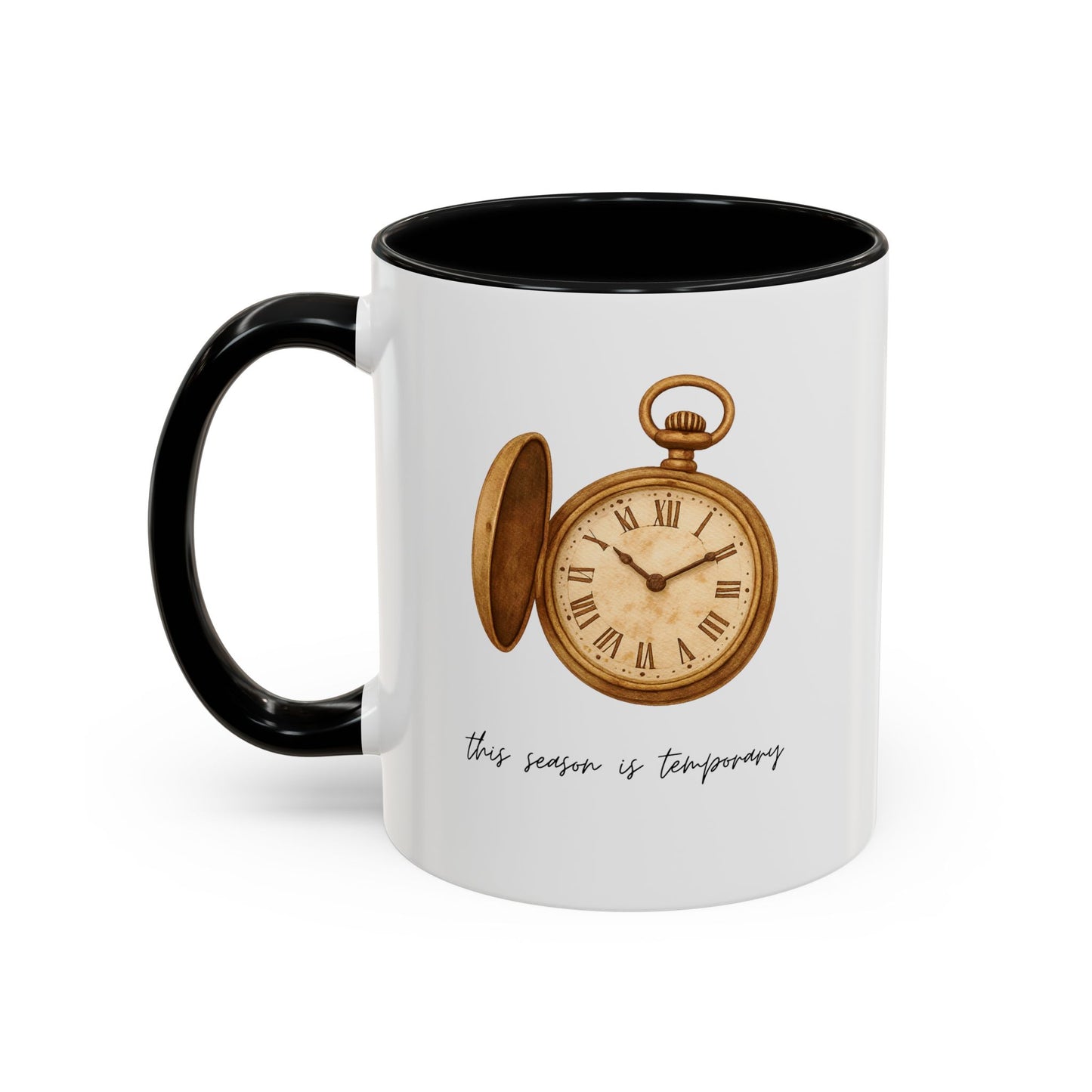 A white ceramic mug with a black handle and black interior, featuring a vintage-style illustration of an open gold pocket watch and the text 'this season is temporary' on the front.