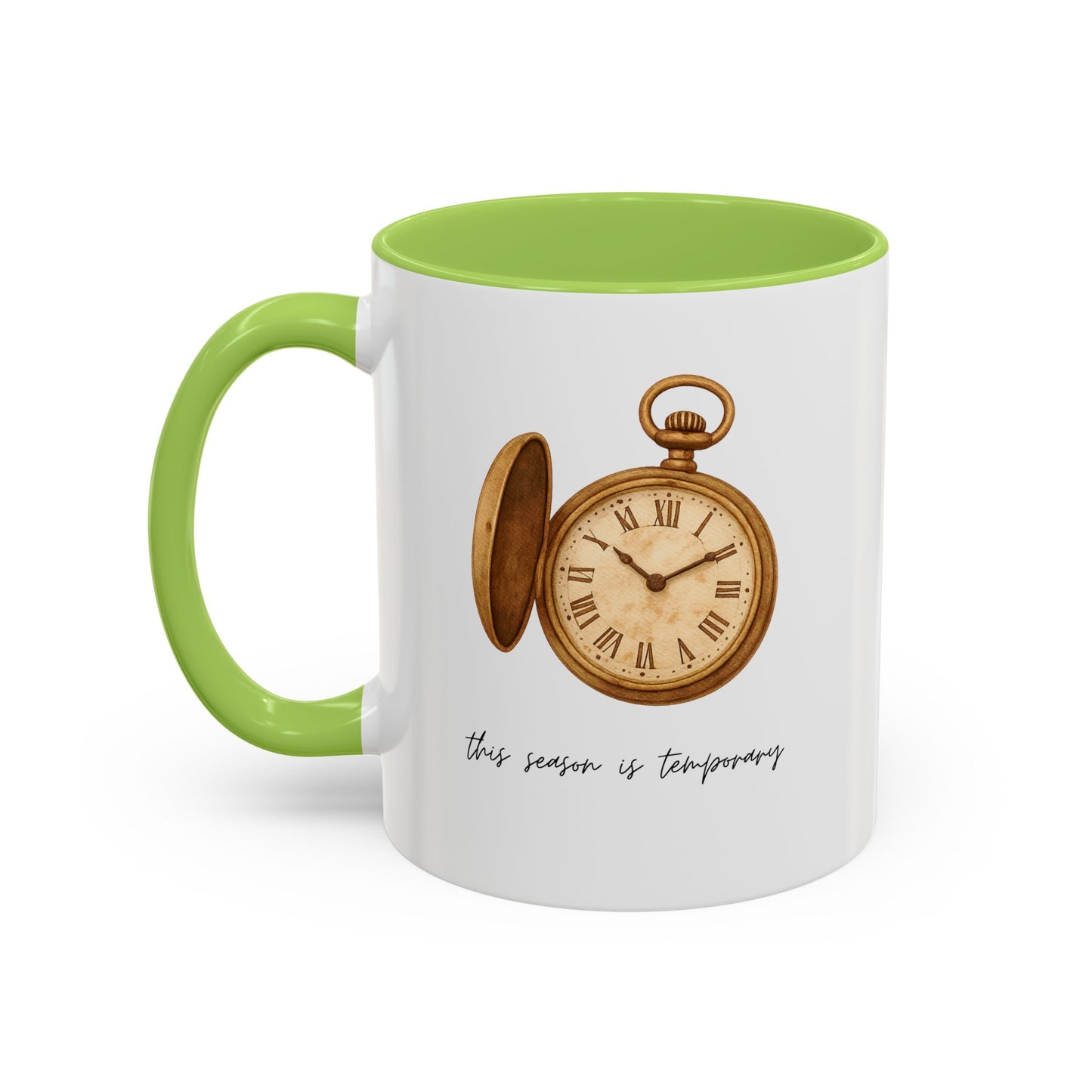 A white ceramic mug with a bright green handle and interior, featuring a vintage-style illustration of an open pocket watch and the text 'this season is temporary' printed on the front.