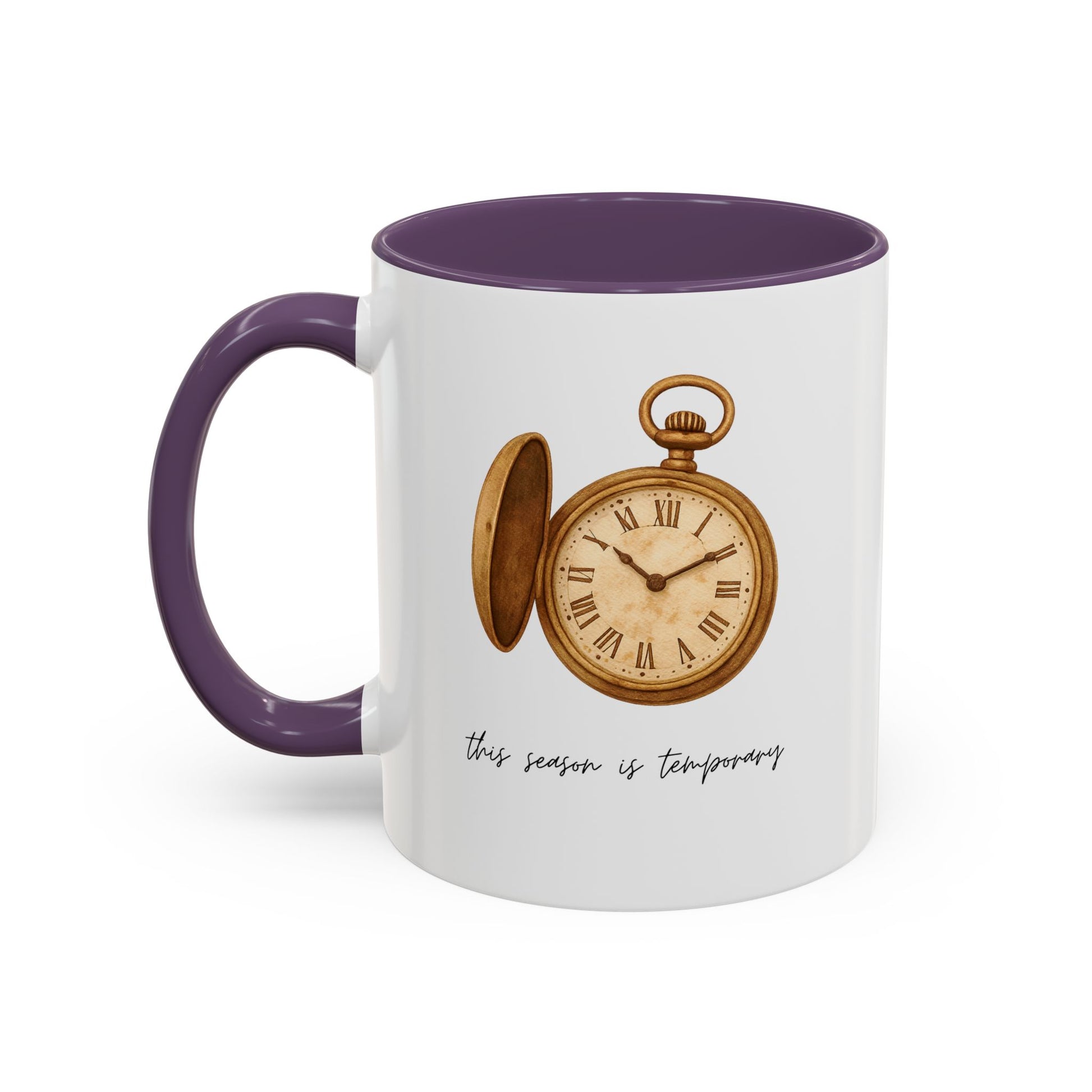A white ceramic mug with a dark purple handle and interior, featuring a vintage-style illustration of an open gold pocket watch with Roman numerals and the text 'this season is temporary' in black script.